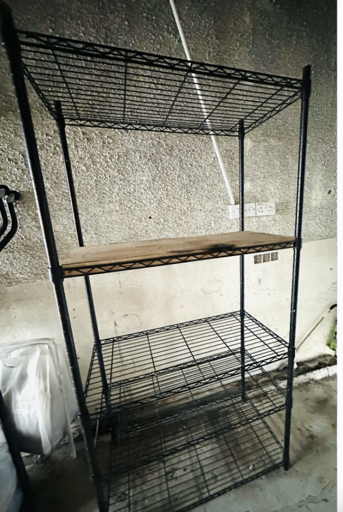 Black Metal Shelving Unit with Wooden Shelf – Fair Condition