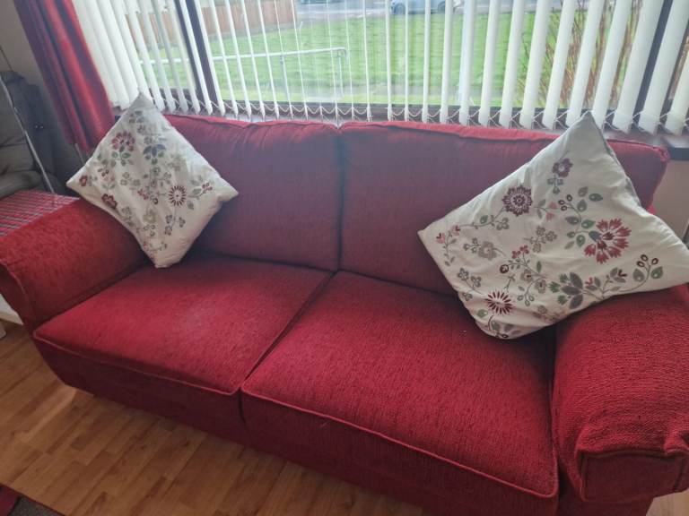 Red three seater sofa