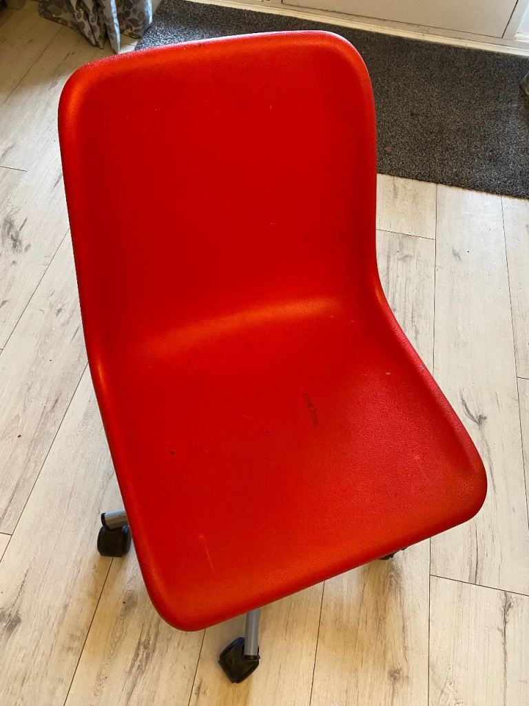 Red swivel chair. 