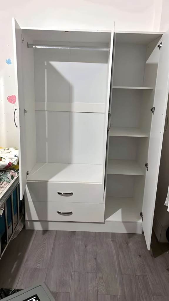 Triple door wardrobe with mirror and drawers 