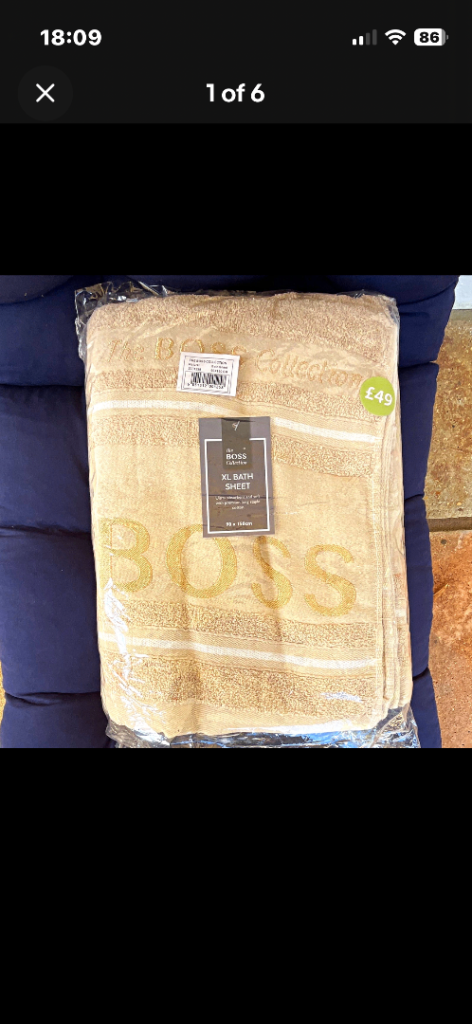 Brand new BOSS bath sheet in a lovely natural colour