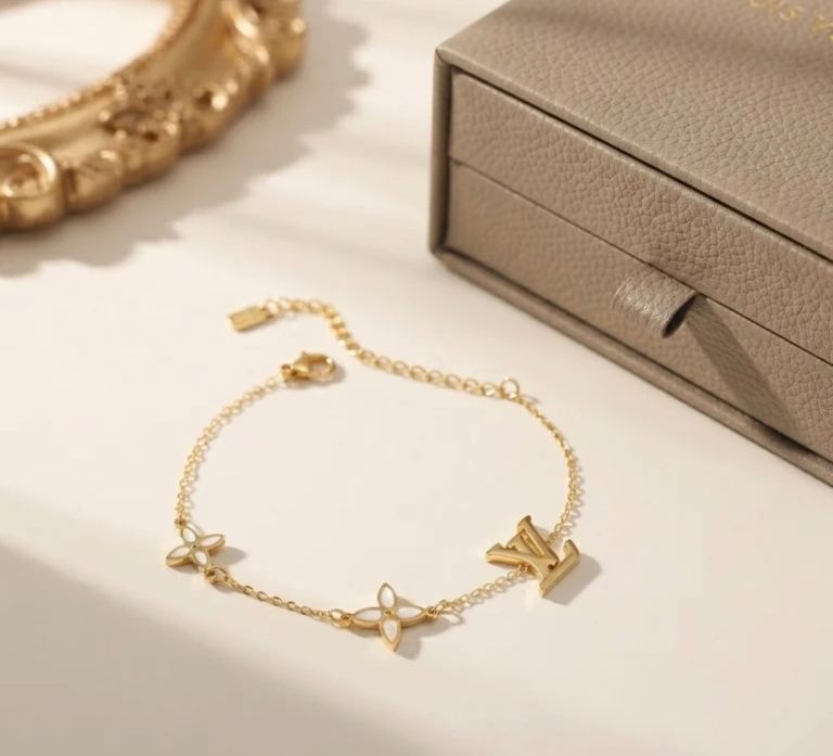 Louis Vuitton Gold Bracelet with White Charms – As Good As New