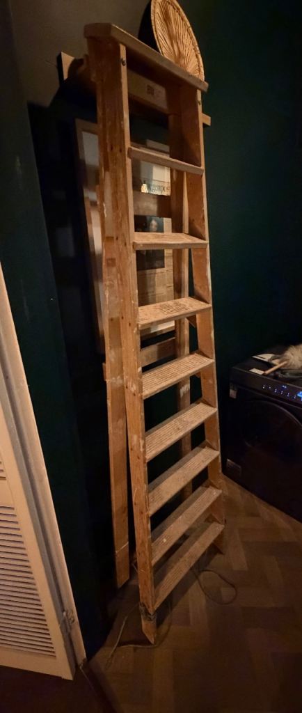 Large wooden decorator’s ladders.