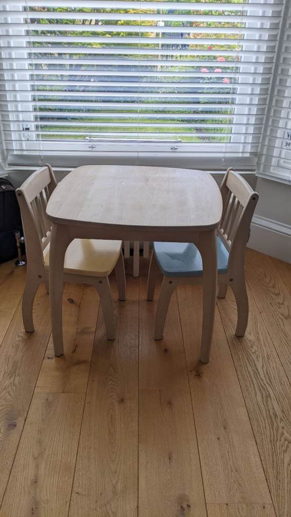 kids wooden table with two chairs