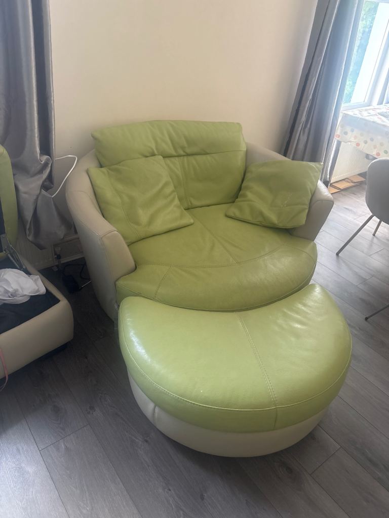 Green large swivel sofa with leg rest 