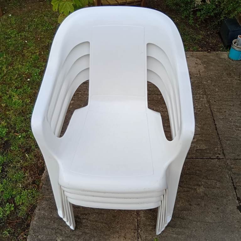 Four very good condition stacking chairs