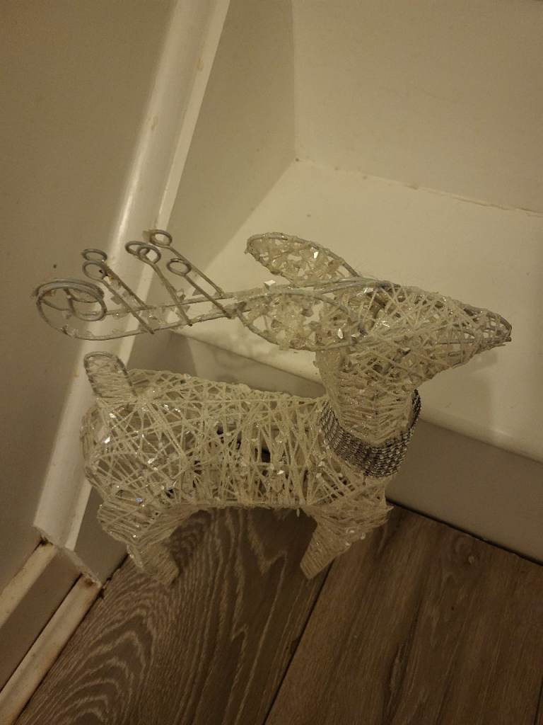 Pair of white glitter reindeers