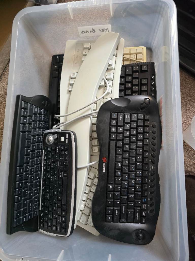 Seven assorted computer keyboards
