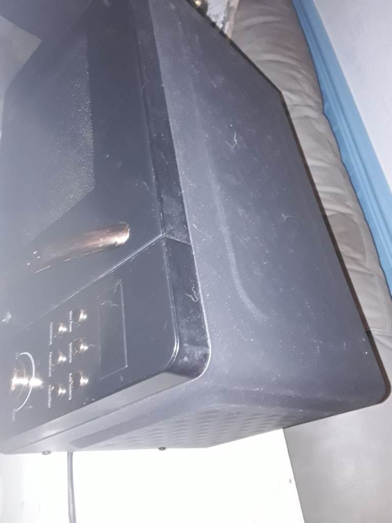  microwave oven very clean black and copper color Dunelm