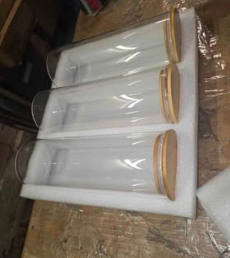 A new still boxed pack of 3 glass jars with wooden lids the m