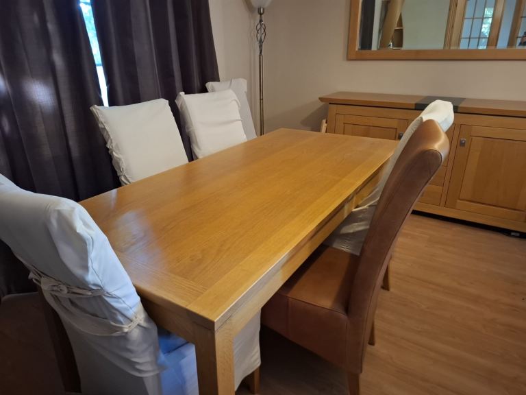 Solid oak dining table and chairs 