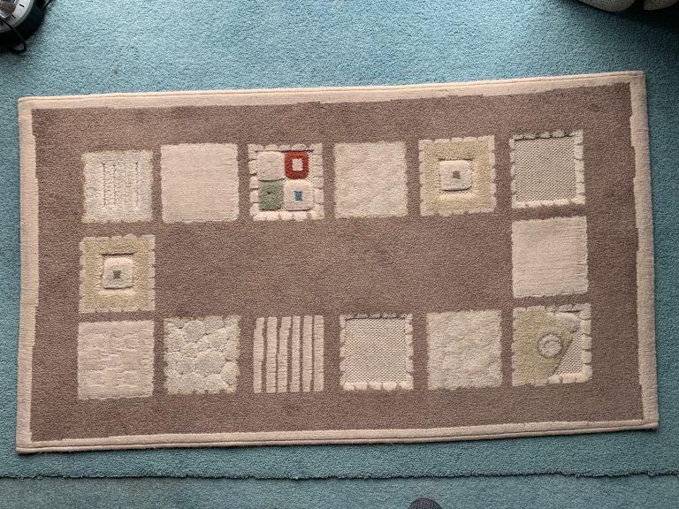Beige rug (bound)