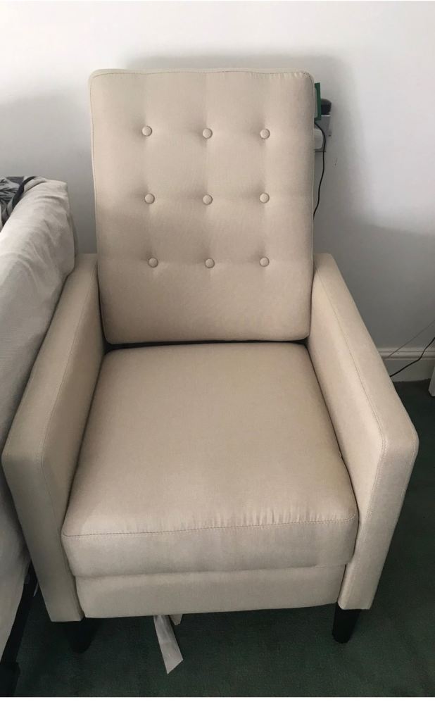 Cream fabric recliner armchair in a very good  condition