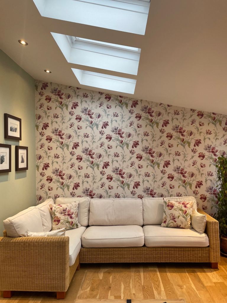 Four seater corner natural rattan sofa and two chairs with Laura Ashley scatter cushions