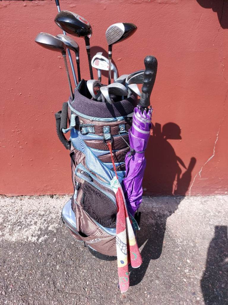 Assorted golf clubs