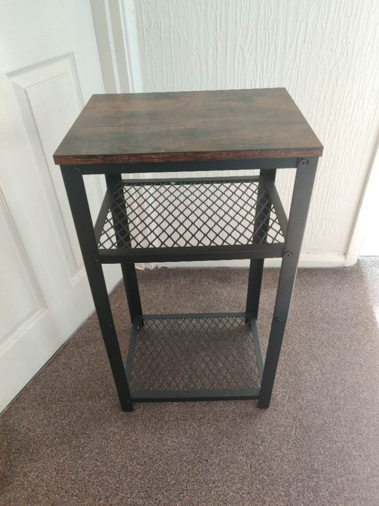 Dark brown and black metal display Unit.