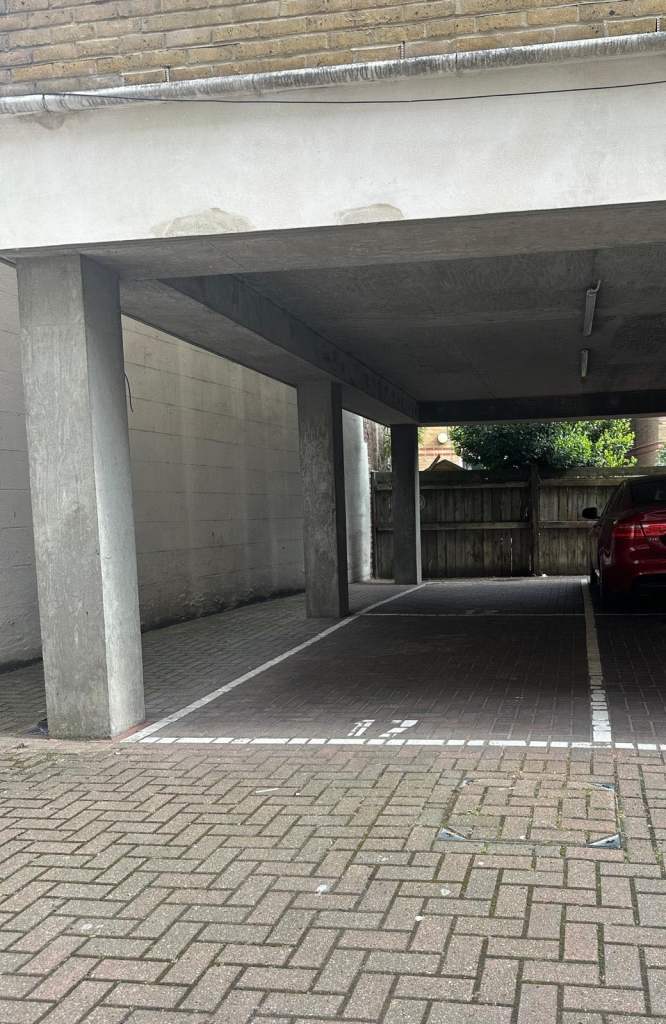 CENTRAL Gated and covered PARKING SPOT E1 