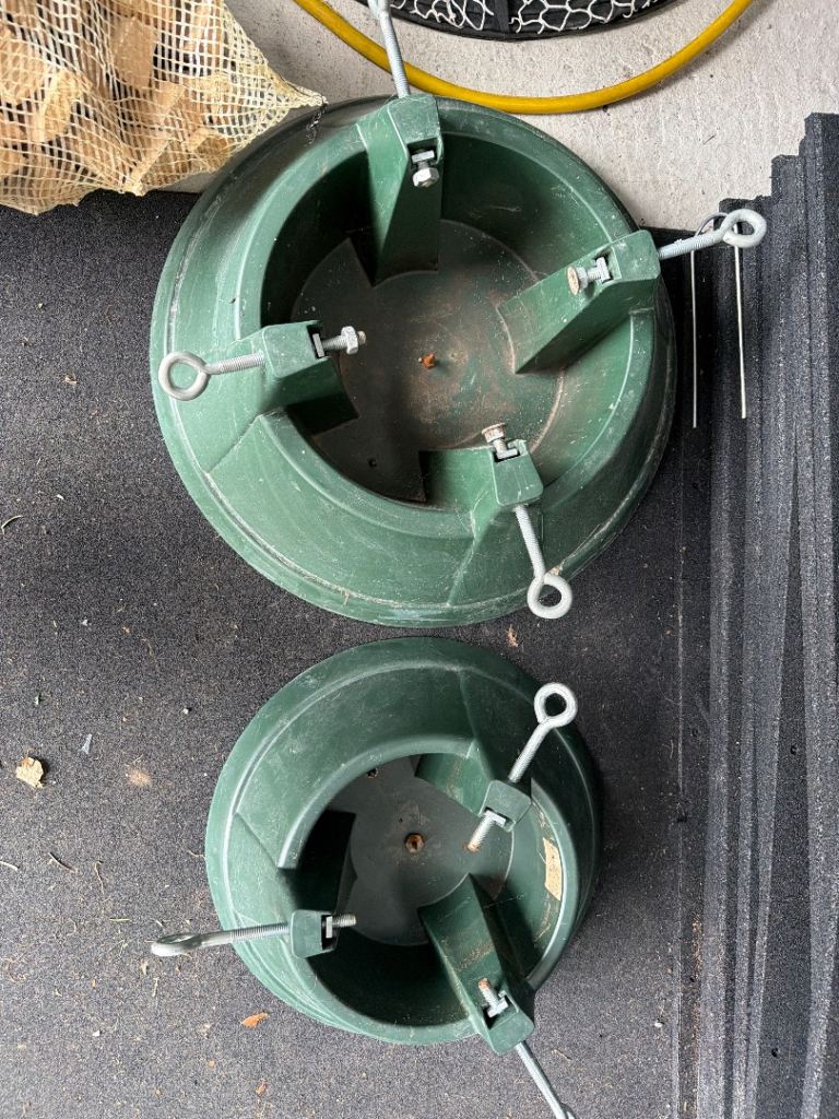 2 adjustable green Christmas tree stands 