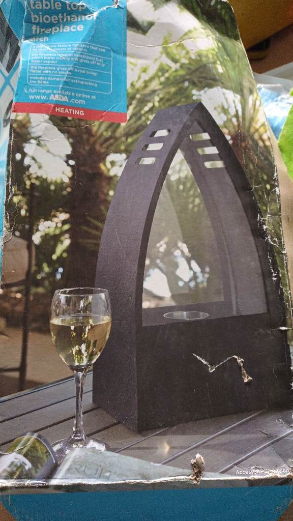 Unused outdoor patio table top ethanol heater