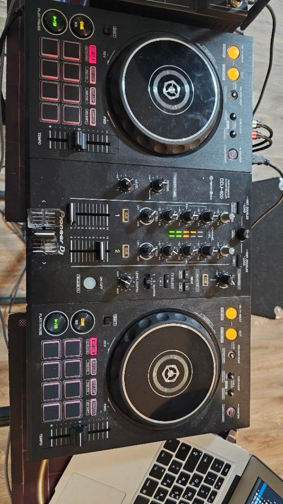 DJ setup 3 speakers controller mixer microphones laptop