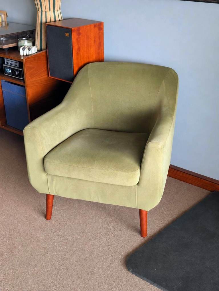 Green velvet tub chair