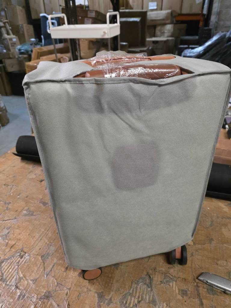 A new 20inch  ivory x brown  coloured hard shell case with cup holder combination lock .