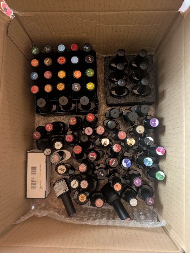 image for Box of assorted Gel nail varnish, with UV lamp.
