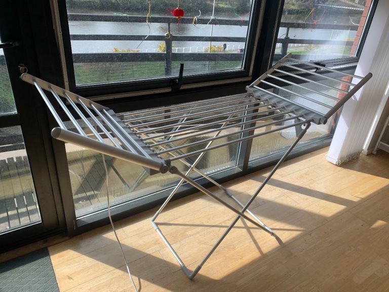 Heated laundry drying rack