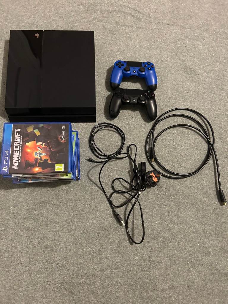 PS4 with controllers and games