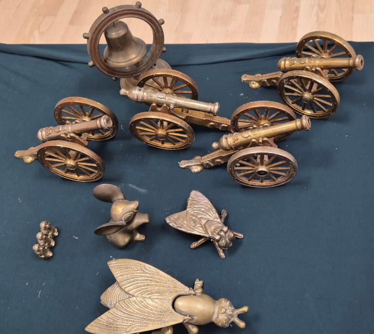 Brass figures and items some very interesting designs Cannons, flying insects, bell, monkeys