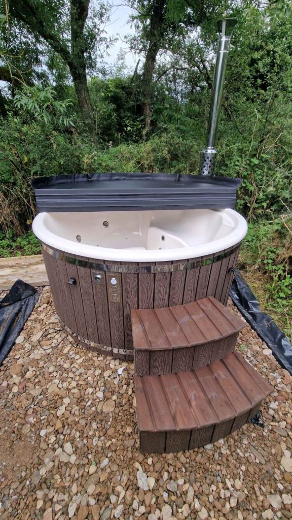 Wood burning hot tub with external stove
