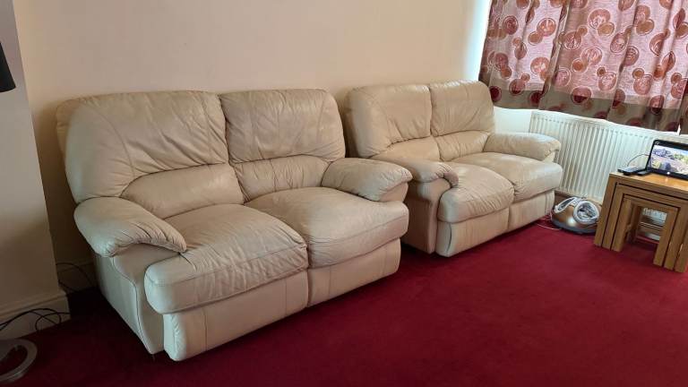 Cream leather 2 X 2 seater matching sofas DFS excellent condition Selling as moving Can Deliver 