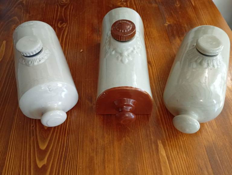 THREE LARGE EARLY 20TH CENTURY STONE PIGS 
