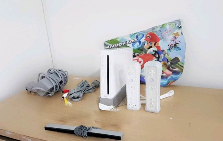 image for Wii + 27 Games + 2 Motion Plus Controllers