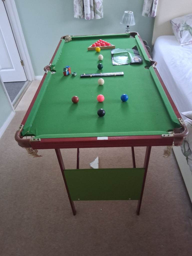 Junior Snooker table, cues,balls and various other items including original instructions.