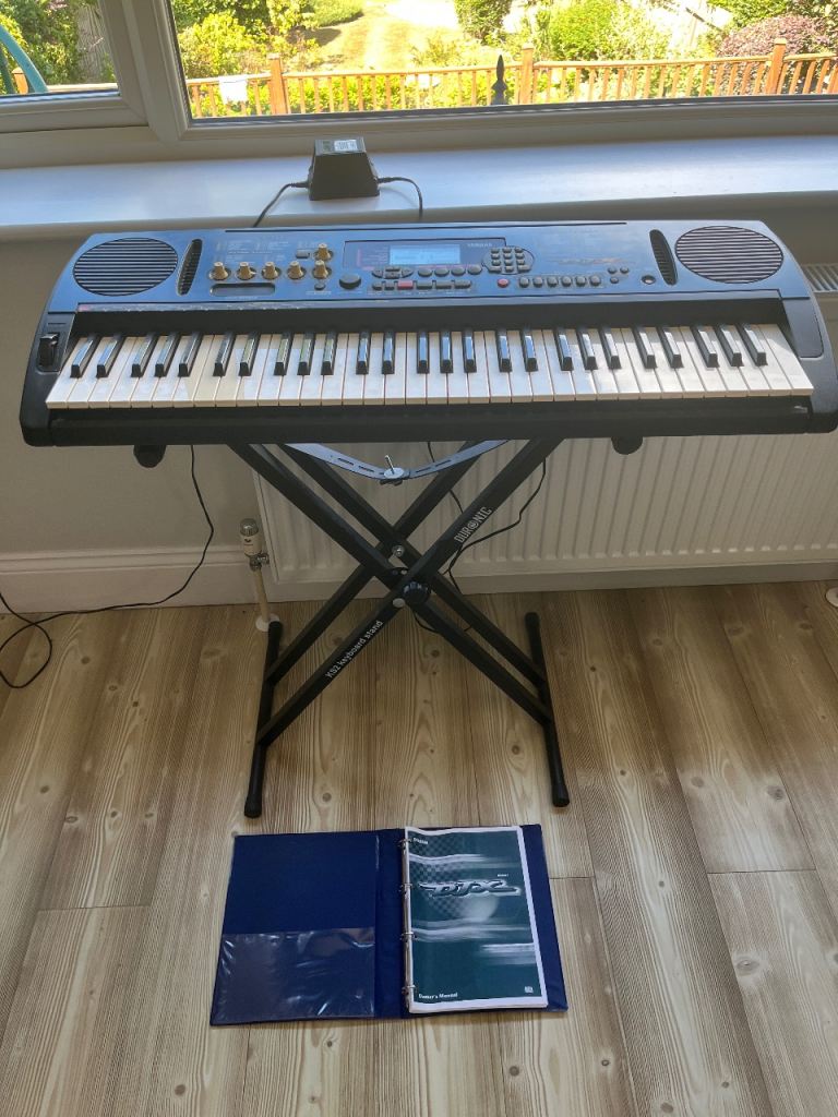 Electronic Keyboard with Stand and Manual– Good Condition