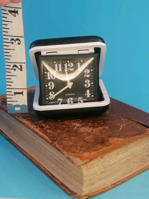 Black  colour, pocket, travel watch. 