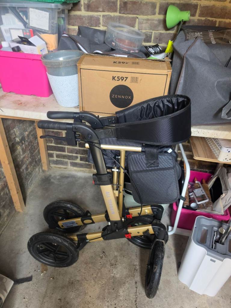 Mobiquip all terrain 4 wheel walking frame with seat and bag.