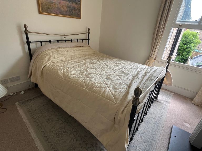 King bed, metal frame with brass knobs 