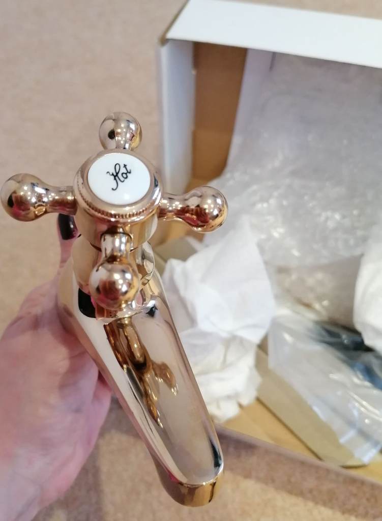 New Deva gold basin taps with fittings. 