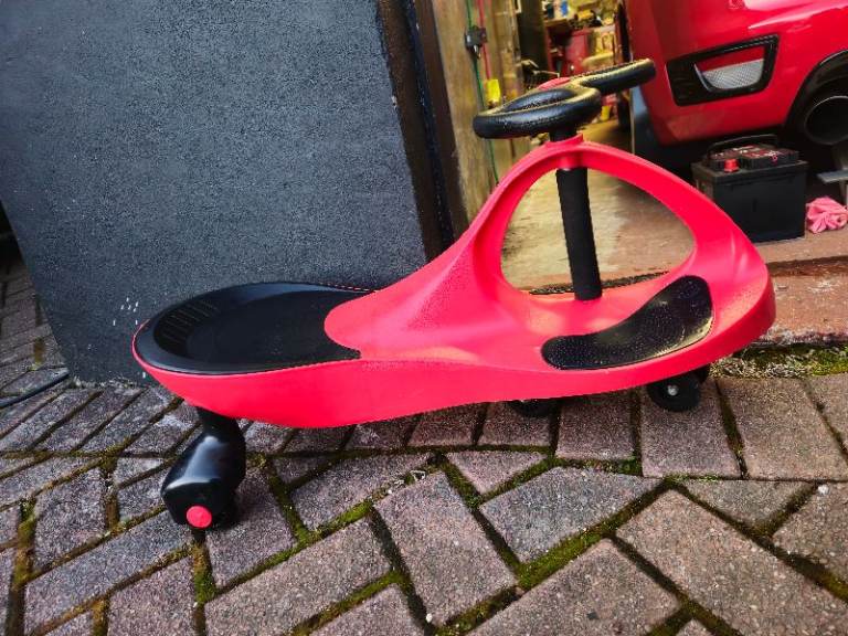 Red Kids Ride-On Wiggle Car – Good Condition