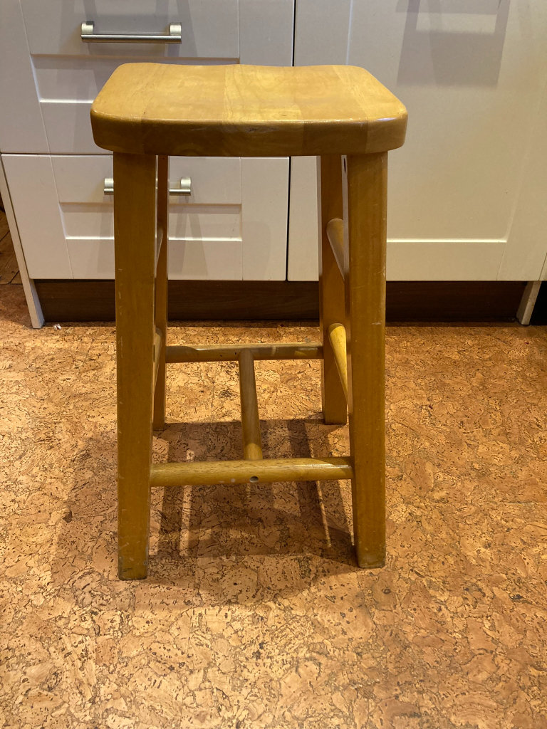 Used sturdy heavy pine kitchen / bar stool with saddle seat. H=66cm (26 inches) 