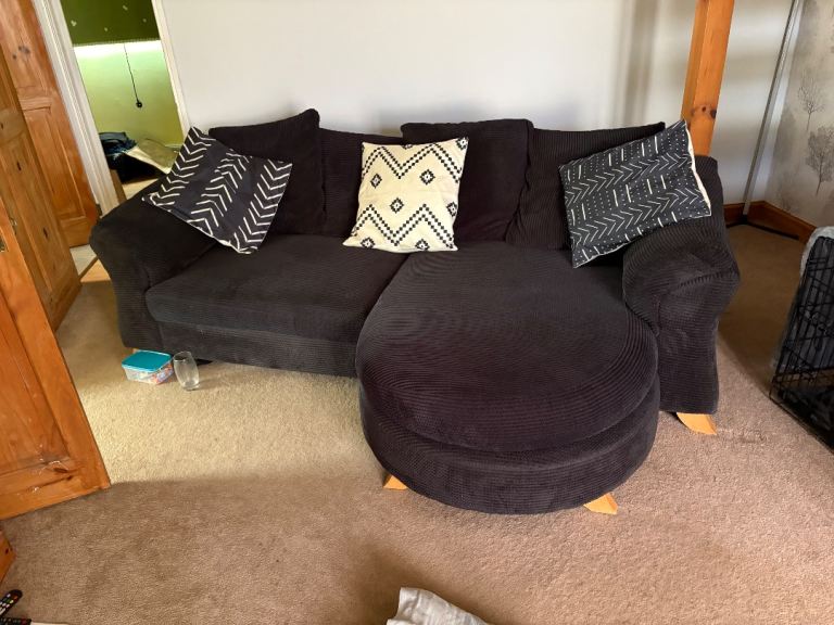 Black Fabric Corner Sofa with Pouffe – Good Condition