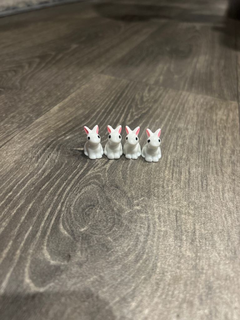 Four rabbit figurines 