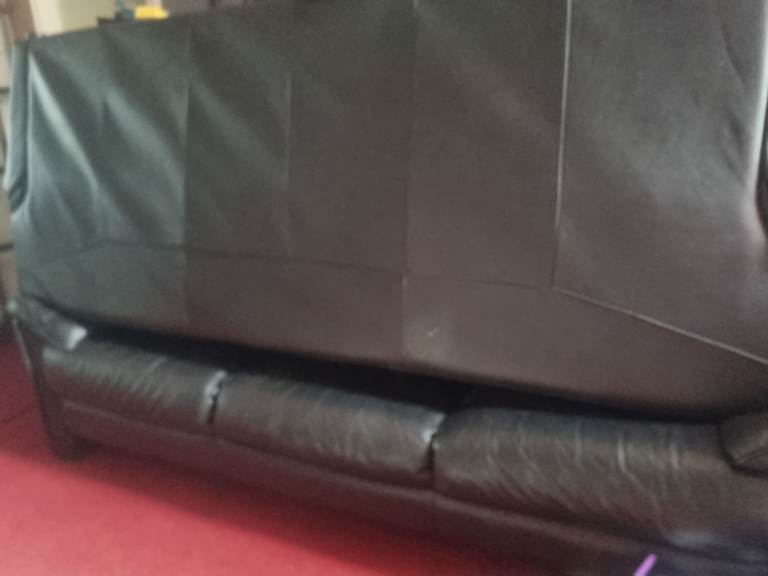 FREE 2 black leather 3 seaters. Read add