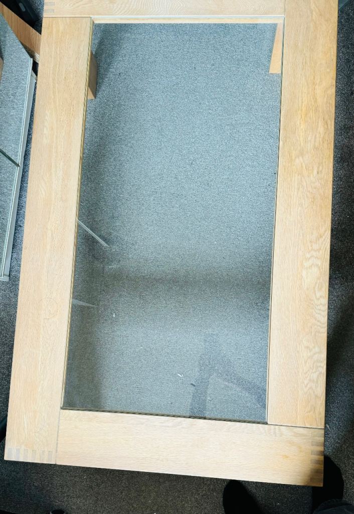 Wood coffee table with heavy glass top. 