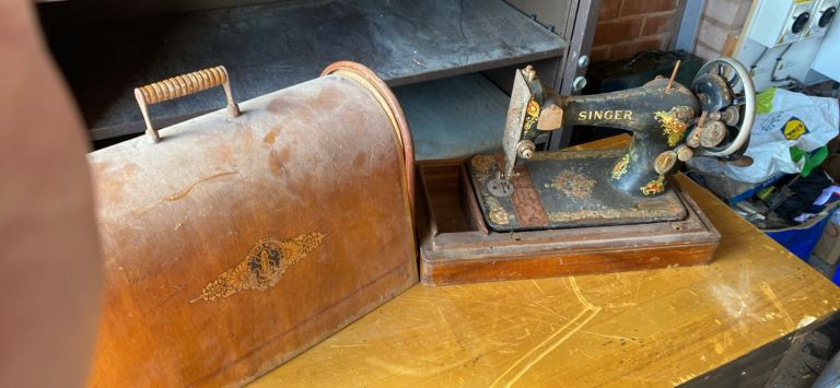 Vintage Singer sewing machine with cover