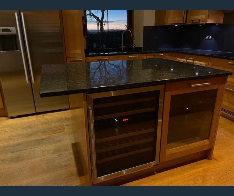 Stunning kitchen island / Bar. Oak with granite top and wine/beer fridge