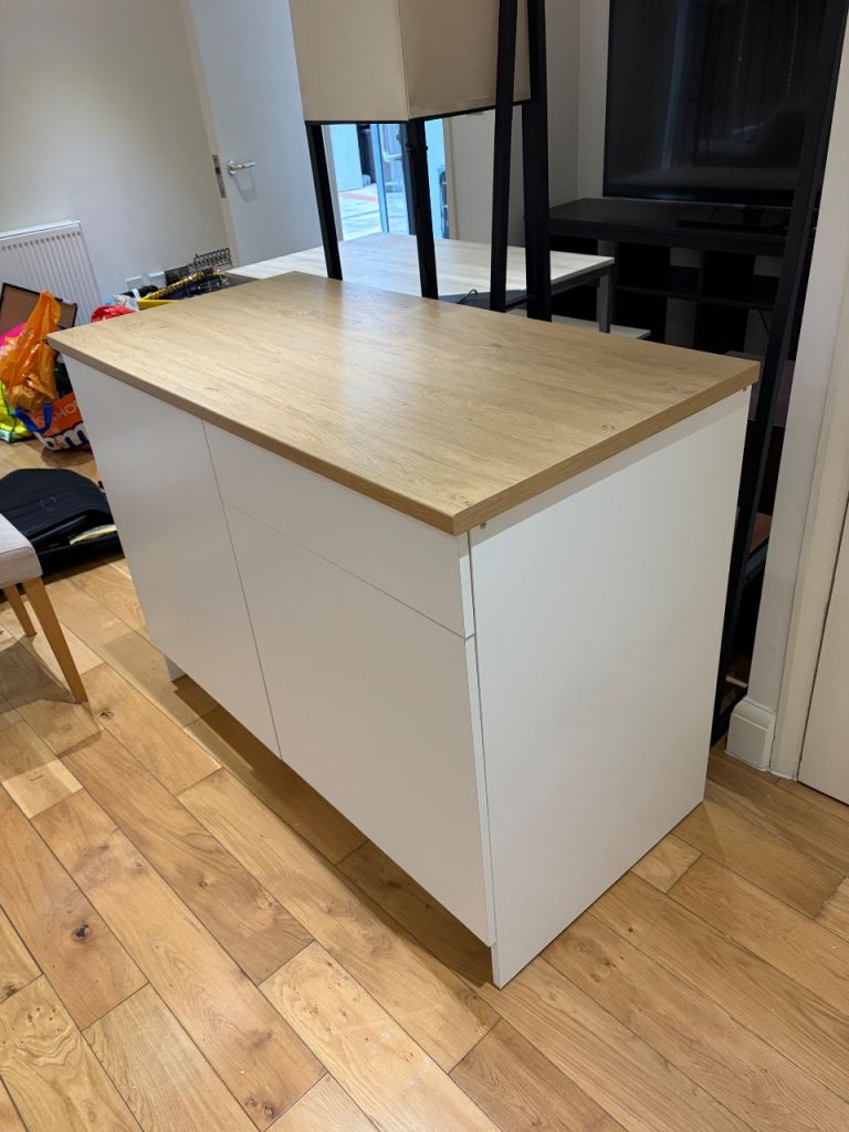 White IKEA Kitchen Unit with Light Wooden Surface