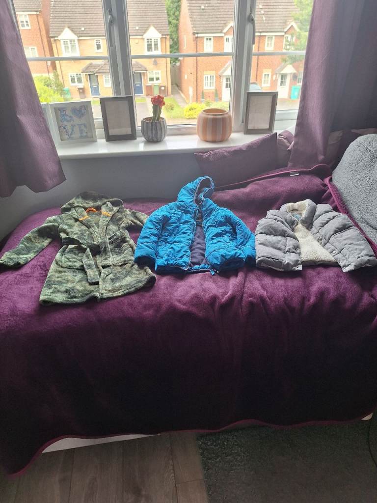A bundle of children clothes size 4 to 5 years coat , gilet jacket and dressing gown 